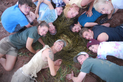 group of students having fun laying in a circle